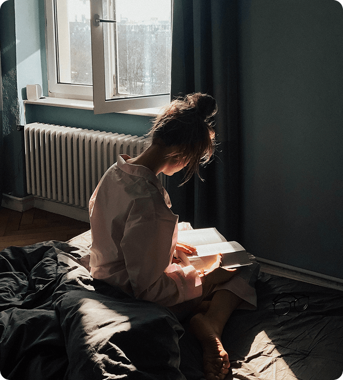 a photo of a woman reading a book